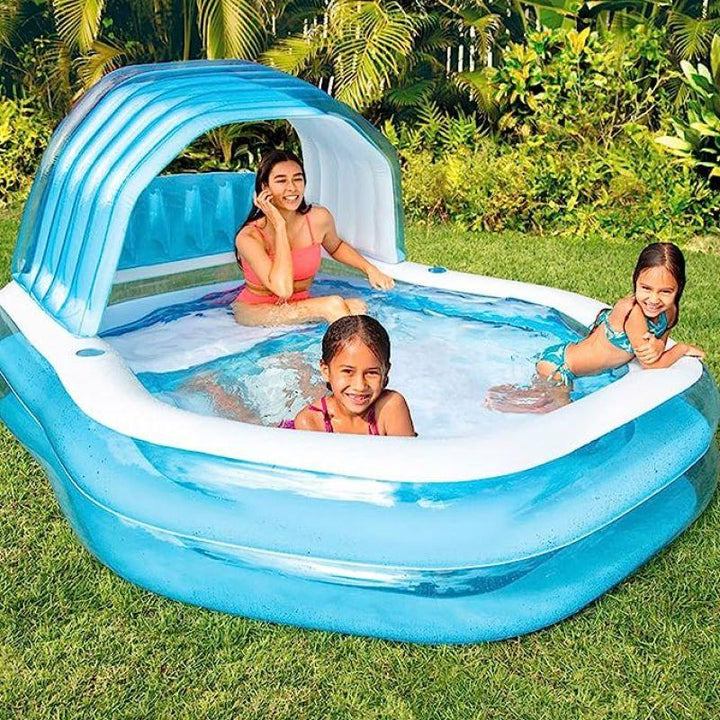 An inflatable family swimming pool - with an umbrella to protect from the sun's rays - for children - ZRAFH