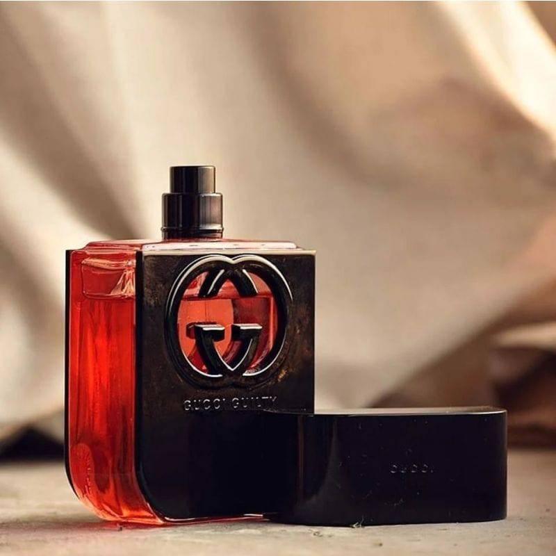 Gucci perfume red and black shop bottle