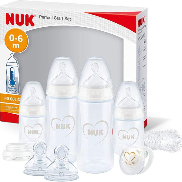 Nuk 4 Piece Baby Bottle Set With Cleaning Brush And Pacifier - White - Zrafh.com - Your Destination for Baby & Mother Needs in Saudi Arabia